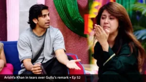 Bigg Boss 20 episode 52: a man in a grey T-shirt talks as a woman in a green outfit cries, captioned Arishfa Khan in tears over Gullu's remark