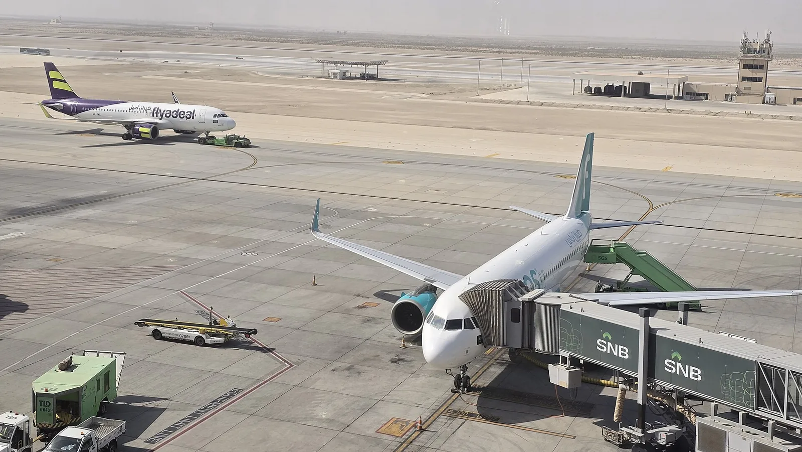Aircraft at the gates of King Fahd International Airport, Dammam, in daylight