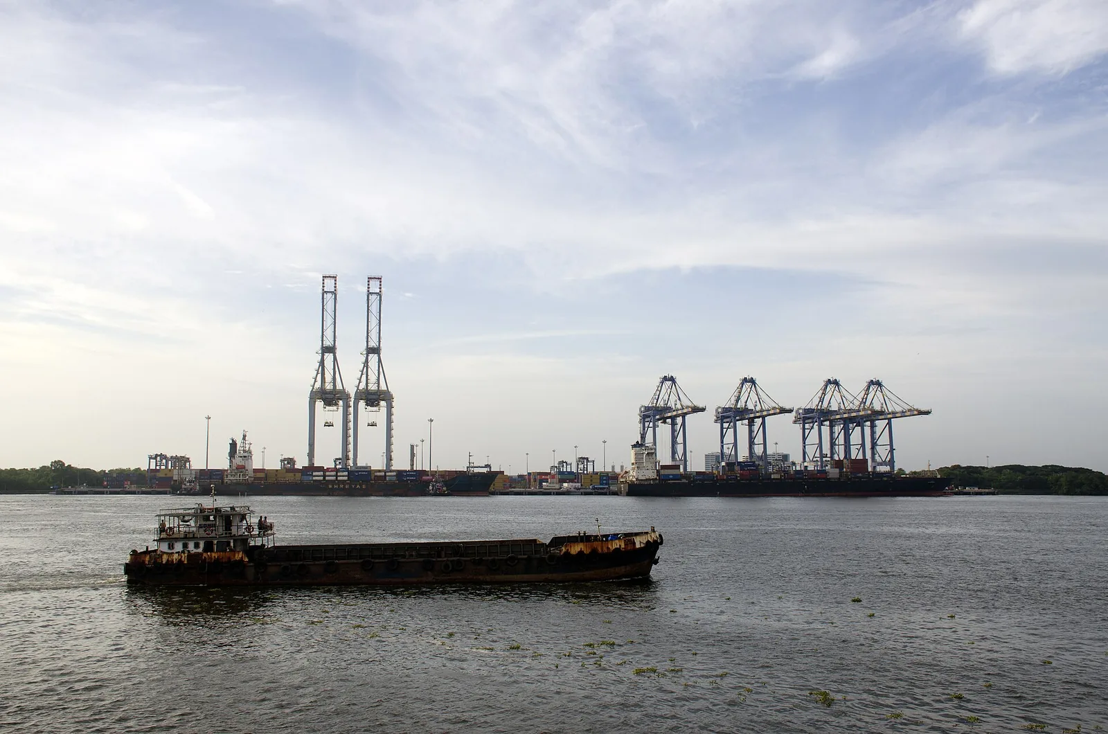 Container terminal at Cochin Port, Vallarpadam, with a barge passing, file photo