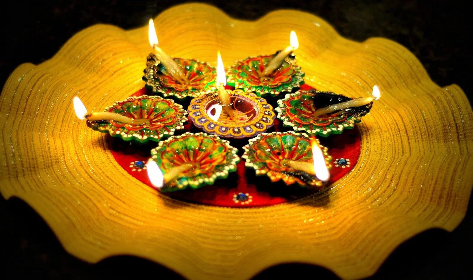 Diwali oil lamps on a decorated plate, 2013 file photo, bank holiday week