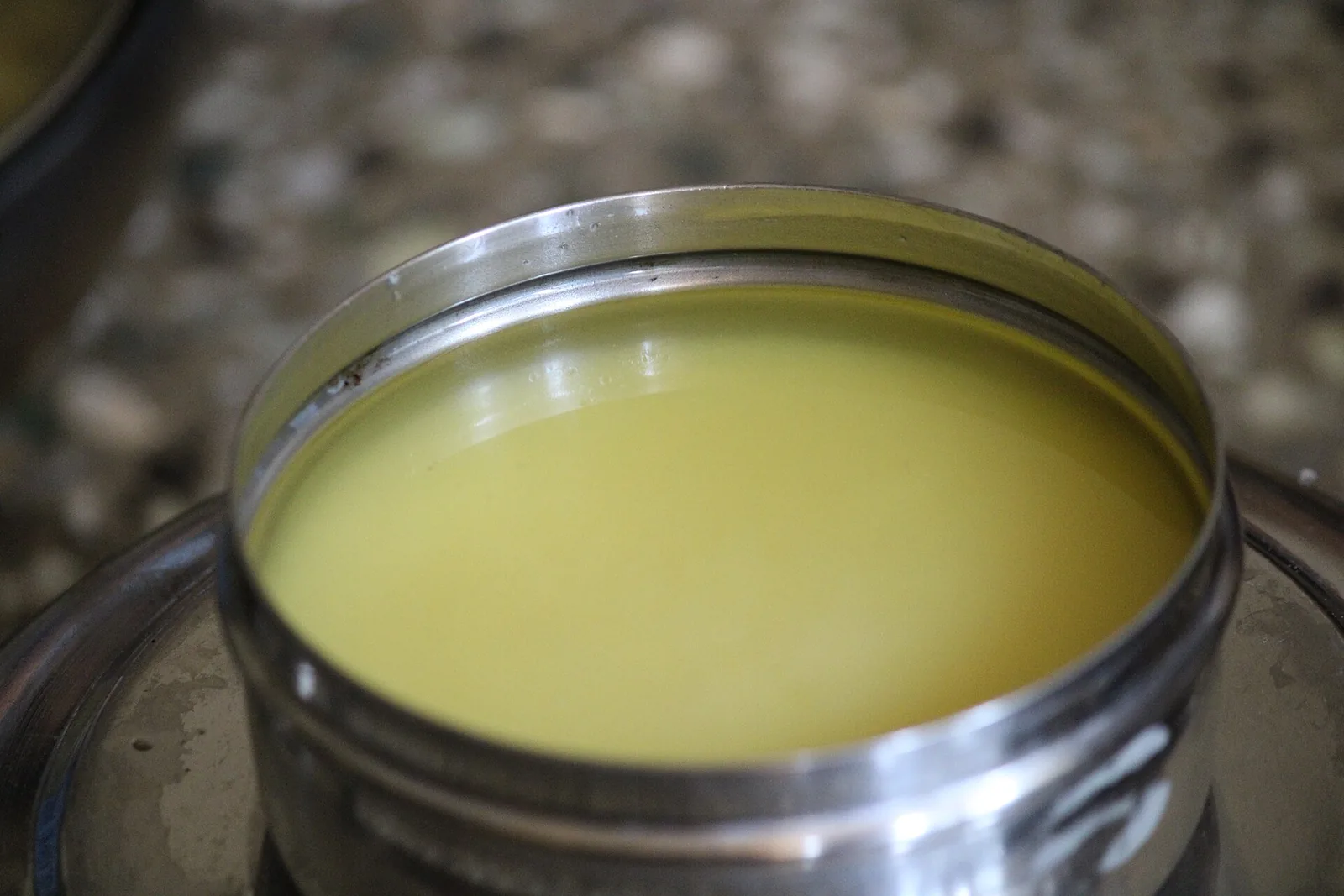 Homemade ghee in a steel container, file photo for Aavin ghee price story