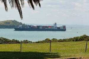India New Zealand FTA: container ship coming into the Port of Auckland, New Zealand