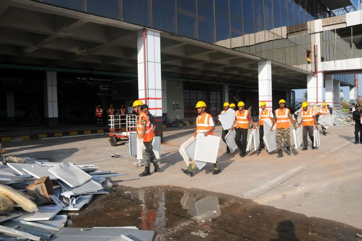 Indian Navy and NDRF teams clearing debris at Visakhapatnam airport after Cyclone Hudhud