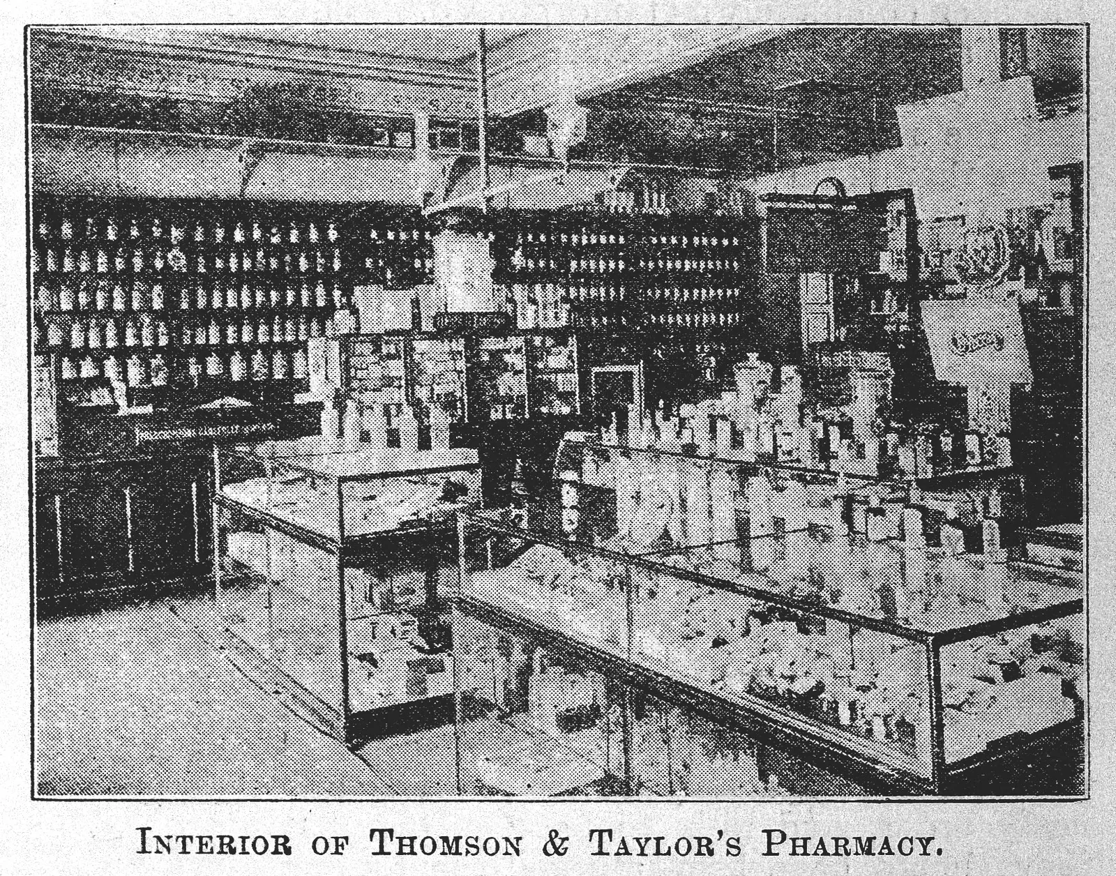 Interior of a pharmacy in Bombay, shown in a 1902 photograph, not a current shop