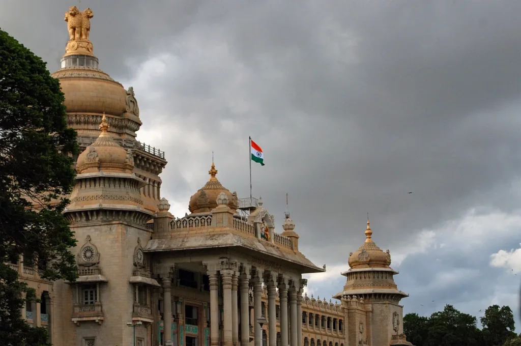 Domes of Vidhana Soudha in Bengaluru under a stormy sky as the Kannadiga jobs row grows