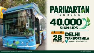 A Delhi Transport Corporation electric bus, with a card reading Parivartan scheme, 40,000 sign-ups, Delhi transport mela on 28 October at Burari, North Delhi