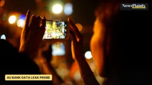 Person filming on a smartphone at night, representative image for the AU Bank data leak probe