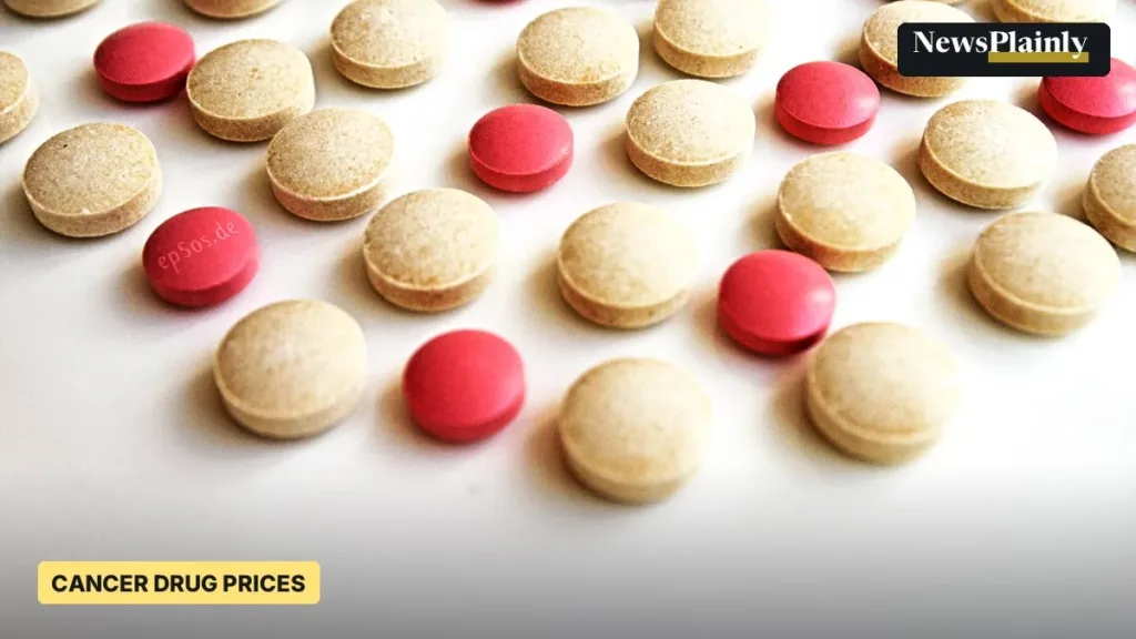 Pink and beige tablets on a white surface, illustrating cancer drug mark-ups