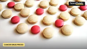 Pink and beige tablets on a white surface, illustrating cancer drug mark-ups