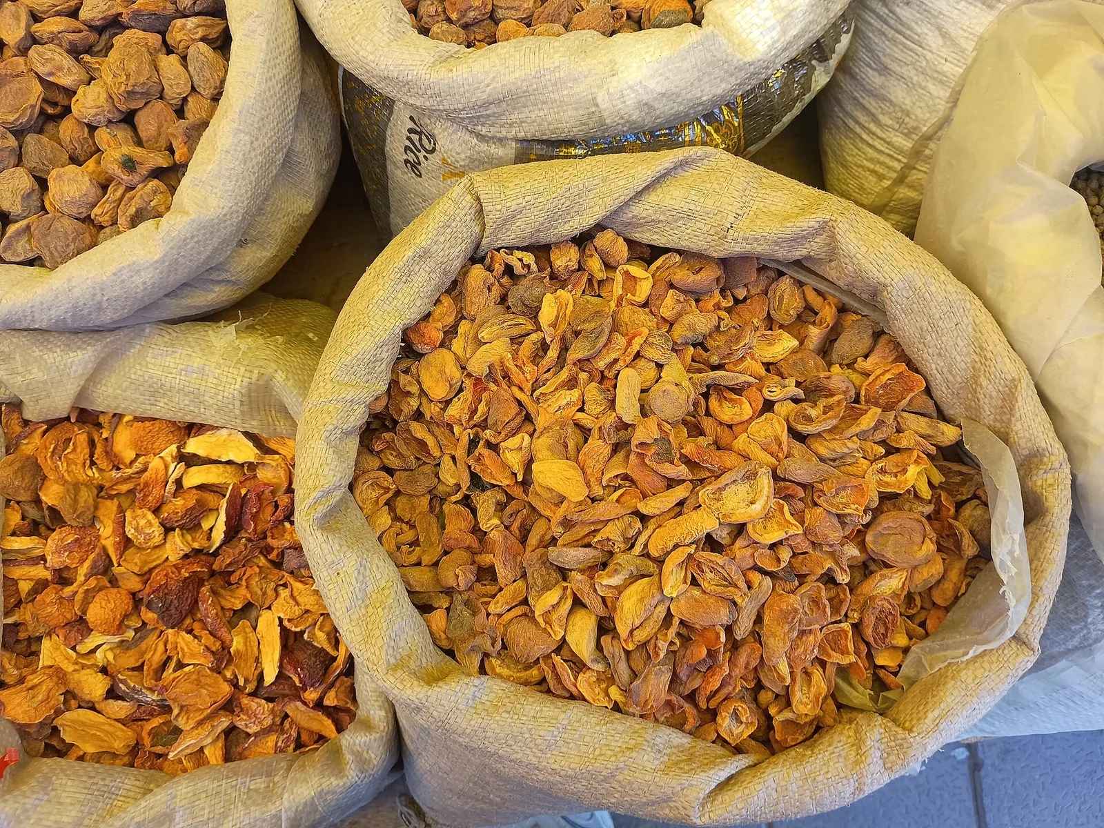 Sacks of dried apricots at a Leh market, a crop Ladakh hopes to sell with organic certification
