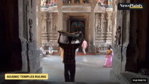 Visitors walking through the entrance hall of the Meenakshi temple, Madurai, one of the Agamic temples, 2009 file photo