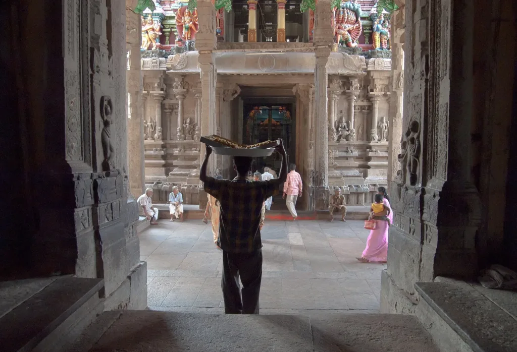 Visitors walking through the entrance hall of the Meenakshi temple, Madurai, one of the Agamic temples, 2009 file photo