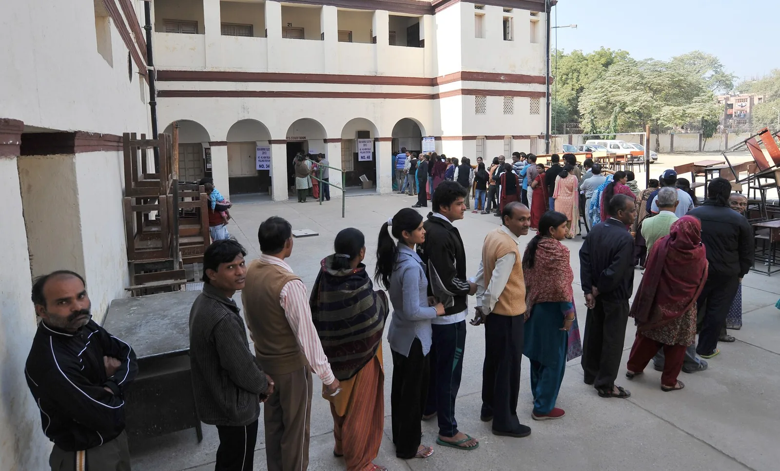 Voters queue at a New Delhi polling station in December 2013, file photo