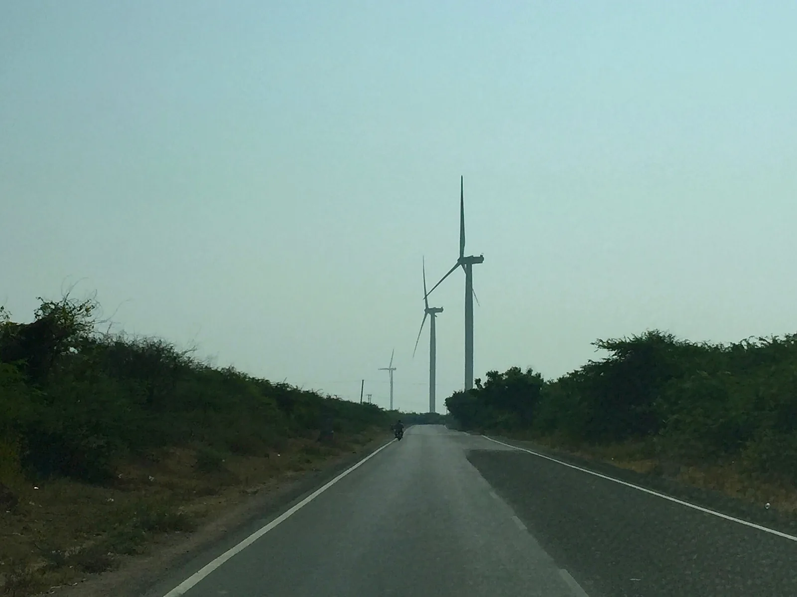 Wind turbines beside a rural road in Gujarat, 2015 file photo